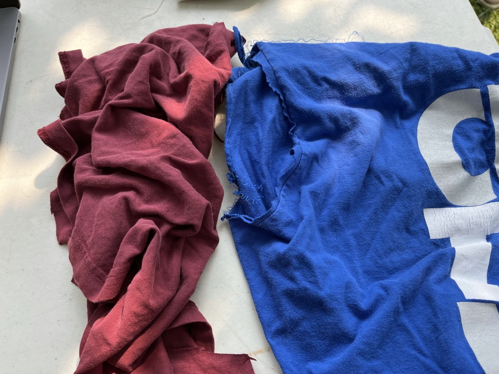 [ID: Red and blue pieces of scrap fabric]
