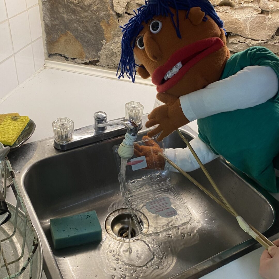 River washes a container in a sink